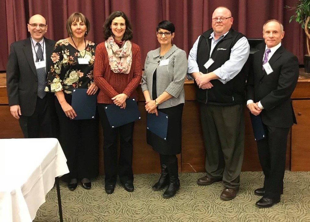 Past chair of Federation, Marc, standing next to three women and two men being recognized for their corporate sponsorship