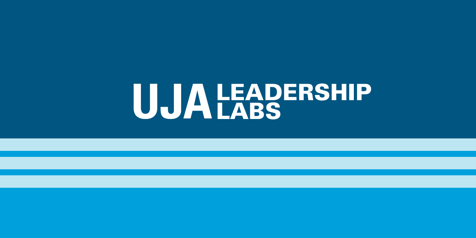 Blue background with the text "UJA LEADERSHIP LABS" in white, accompanied by light blue horizontal stripes at the bottom.