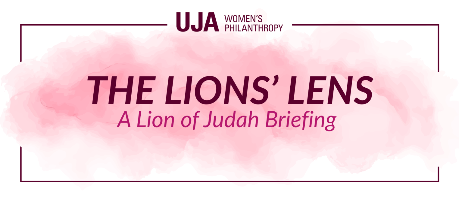 A graphic with a soft pink watercolor background featuring the text "THE LIONS' LENS" and "A Lion of Judah Briefing" in dark maroon, along with "UJA WOMEN'S PHILANTHROPY" at the top.