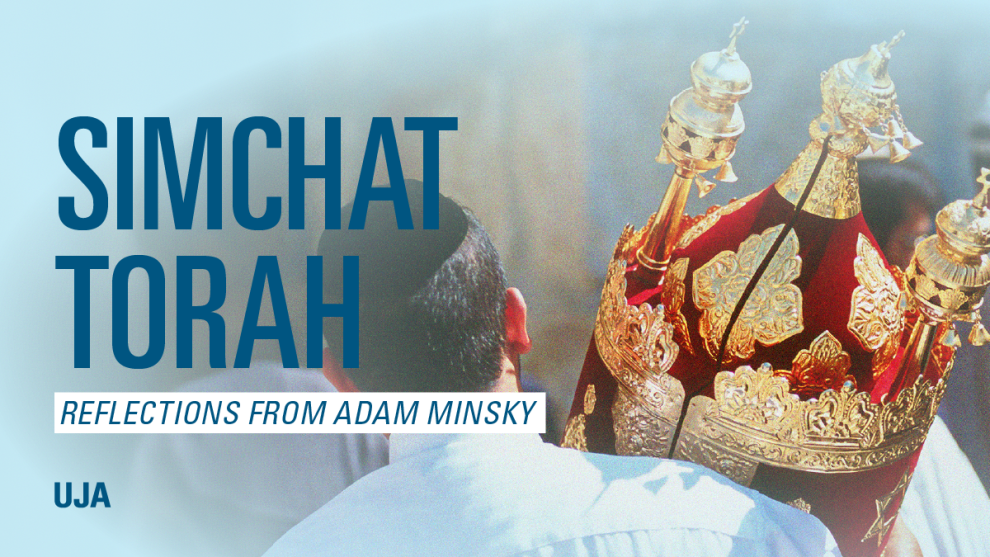 A close-up of a decorative Torah crown held by a person, with the back of their head visible; text reads "SIMCHAT TORAH" and "REFLECTIONS FROM ADAM MINSKY."