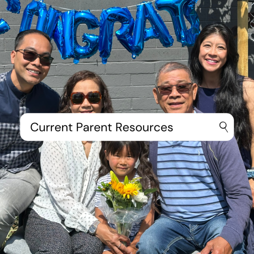 A pre-k graduate sits with family