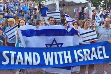 Group of People Holding Israeli Flag - JFC-UIA 2015 Annual Report 