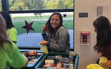 Dana sorting non perishables for a food drive
