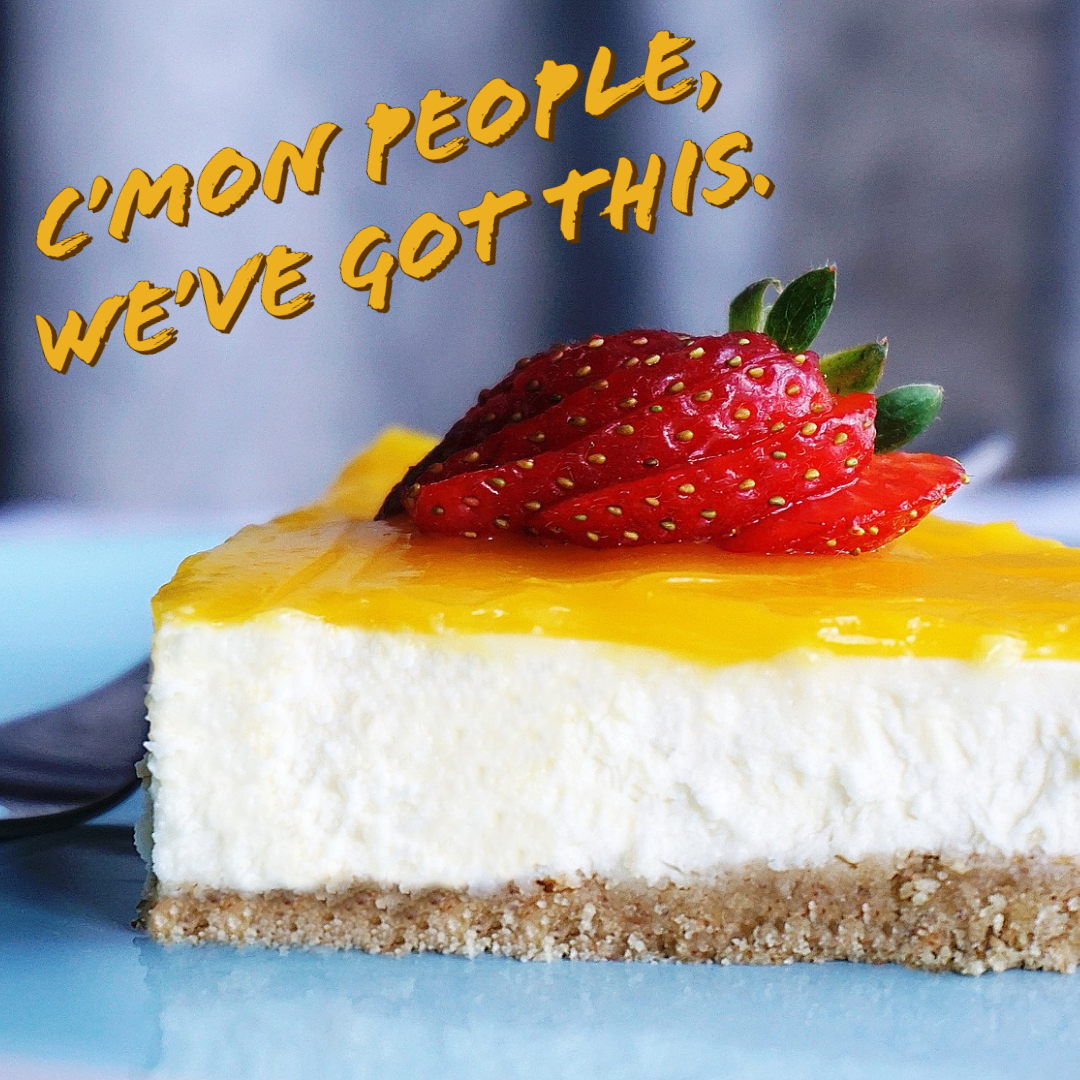Slice of cheesecake with strawberries on top, writing on image 