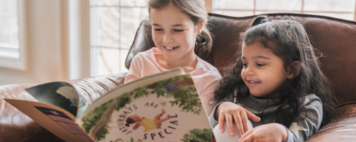 Young children reading together