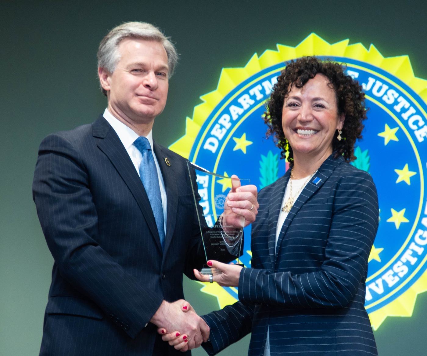 FBI Director Christopher Wray congratulates Jewish Federation of Cincinnati CEO Danielle V. Minson