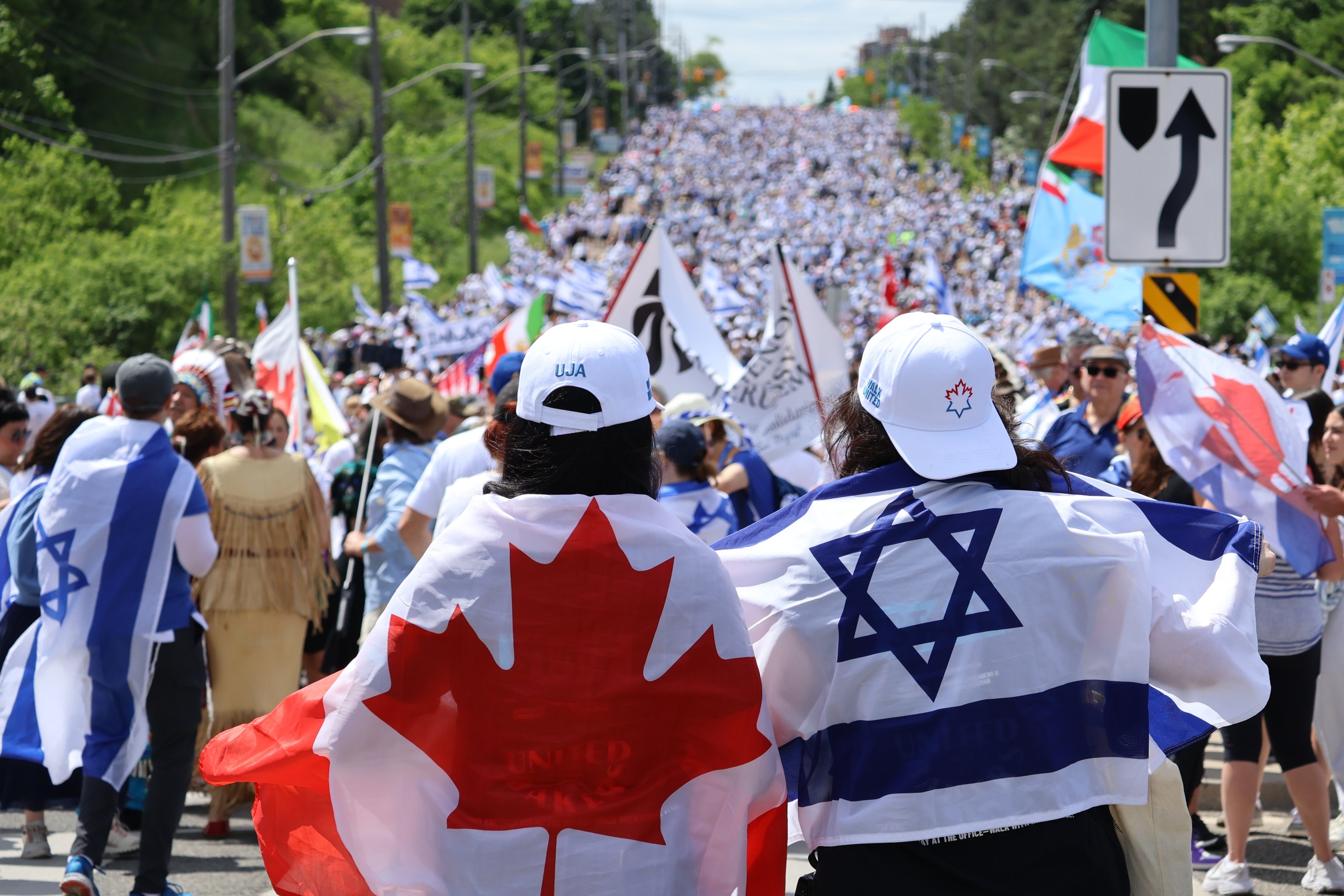 A large crowd carrying Israeli and Canadian flags at Toronto's 2026 Walk with Israel